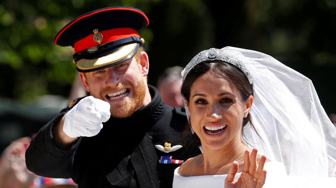 Prince Harry and Meghan Markle ride in an Ascot Landau 