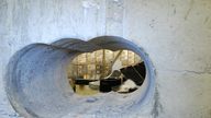 The burglars used a drill to bore a hole in the wall of the vault