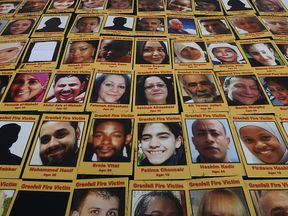 Photos of the Grenfell victims were laid out in Parliament Square ahead of the start of the inquiry
