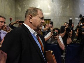 Harvey Weinstein exits the court room after his arraignment at Manhattan Criminal Court on May 25, 2018 in New York City