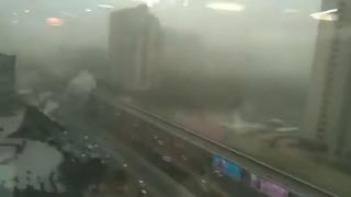 Dust shrouds a tower in India during storms