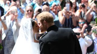 Prince Harry and Meghan Markle kiss