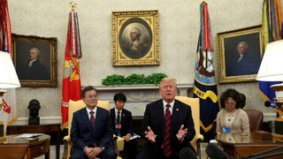 U.S. President Donald Trump welcomes South Korea's President Moon Jae-In in the Oval Office of the White House in Washington, U.S., May 22, 2018. 