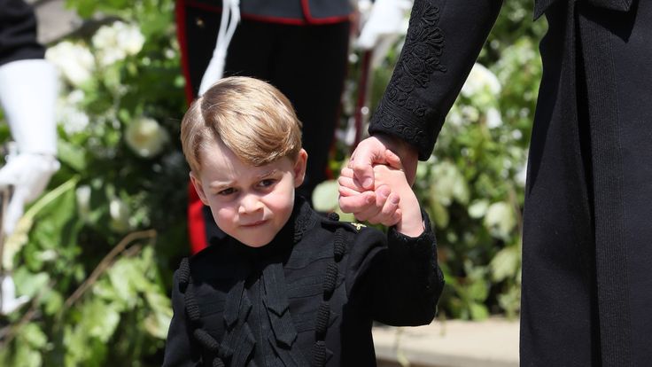 Prince George on the steps of St George's Chapel in Windsor Castle after the wedding of Prince Harry and Meghan Markle. PRESS ASSOCIATION