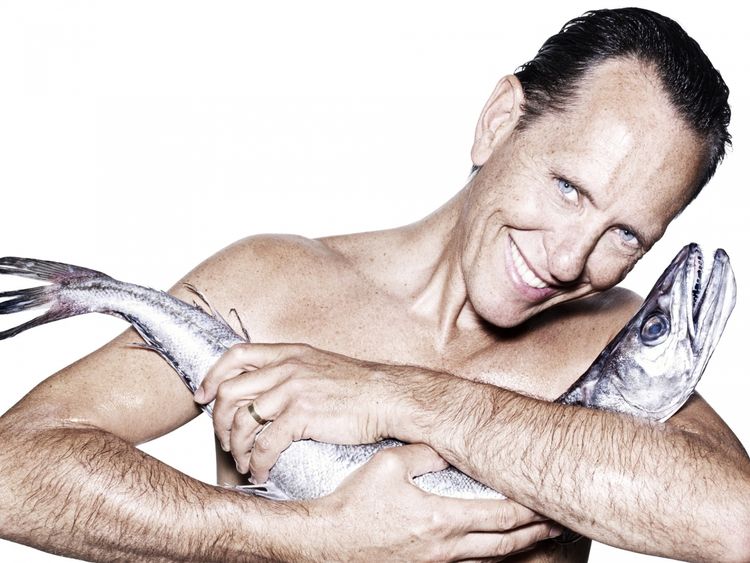 Richard E Grant cuddling a hake. Pic: Fishlove/Rankin