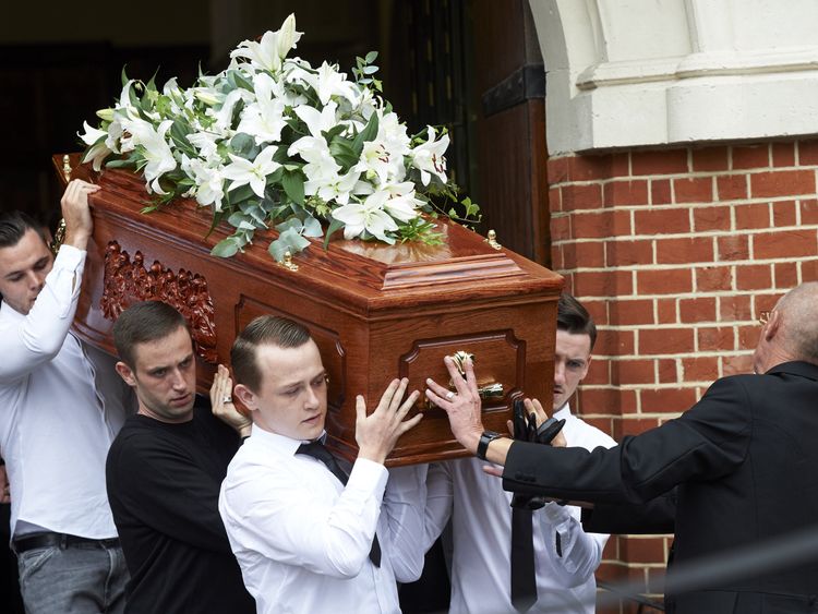 The coffin of Anthony Disson is carried by pallbearers at his funeral on 29 June 2017