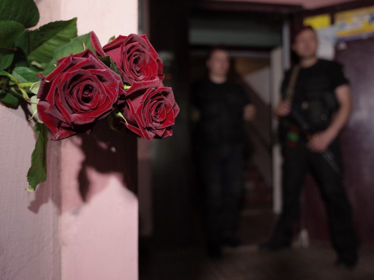 Flowers have been left at the apartment building where Mr Babchenko was shot