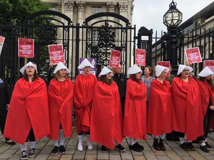 Protesters in costumes similar to those in TV drama The Handmaid's Tale