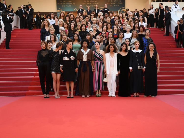  Directors, actresses and industry representatives pose on the red carpet in protest of the lack of female filmmakers honored throughout the history of the festival at the screening of 'Girls Of The Sun (Les Filles Du Soleil)' during the 71st annual Cannes Film Festival at the Palais des Festivals on May 12, 2018 in Cannes, southeastern France. - Only 82 films in competition in the official selection have been directed by women since the inception of the Cannes Film Festival whereas 1,645 films 