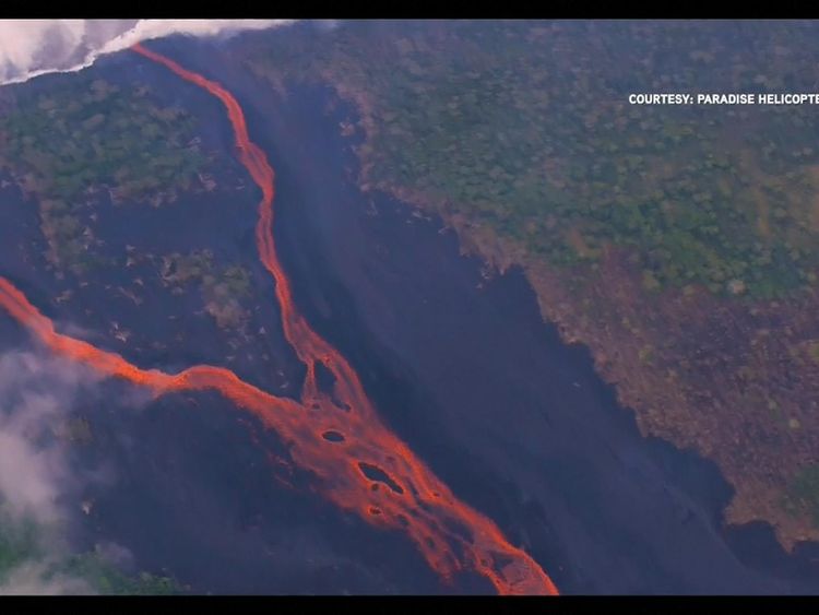 Steam clouds are released where the lava hits water