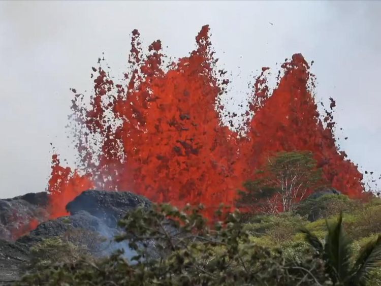 Lava erupts from an underground chamber below the fissure