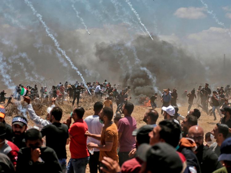 Israeli forces fire tear gas at Palestinians near the border