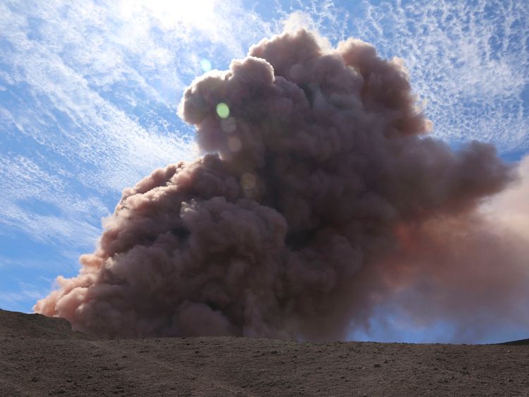 A plume of ash rises from the Puu Oo vent on Hawaii's Kilaueaa Volcano