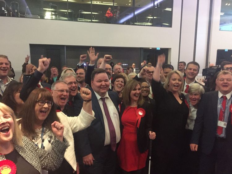 Labour councillors in Trafford celebrate as the Conservatives lose overall control