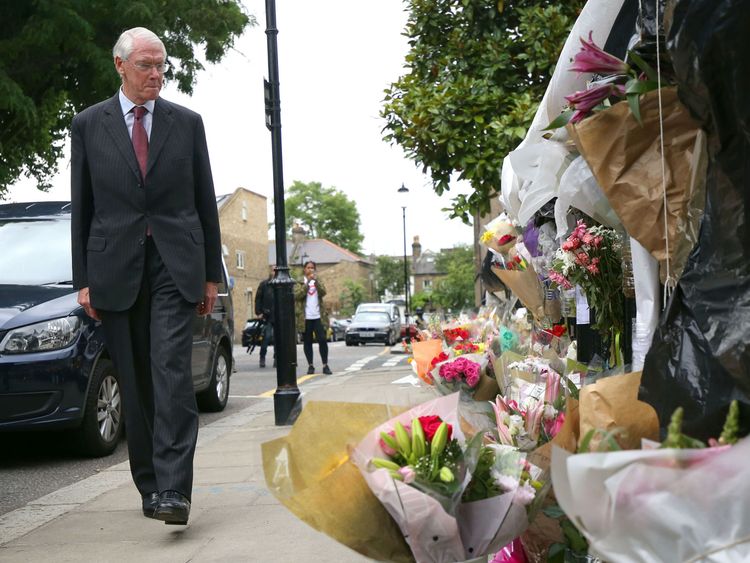 The head of the inquiry Sir Martin Moore-Bick looks at tributes to the Grenfell victims