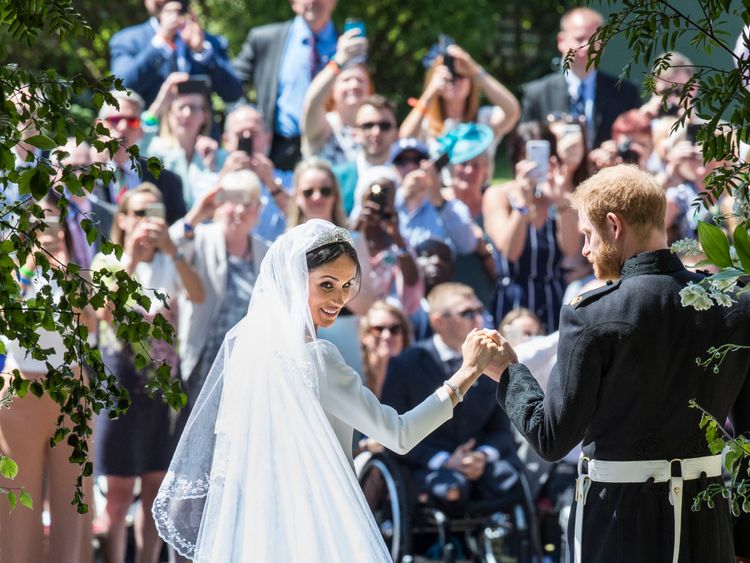 The Duke and Duchess of Sussex on the steps of St George&#39;s Chapel