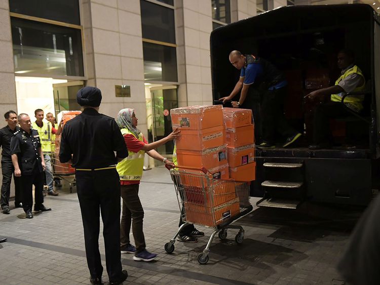 Police took away crates from one of Najib Razak’s apartments in May