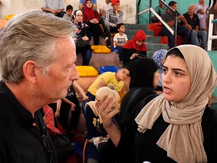 Noura el Shawa is a Palestinian waiting to get on a bus for Egypt