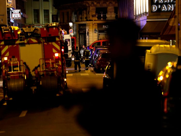 Policemen stand guard in Paris centre past firefighters vehicles after one person was killed and several injured by a man armed with a knife, who was shot dead by police in Paris on May 12, 2018. - The attack took place near the city&#39;s main opera house. Police indicated that the attacker had been &#39;overcome&#39; and his motives are unknown. (Photo by Thomas SAMSON / AFP) (Photo credit should read THOMAS SAMSON/AFP/Getty Images)
