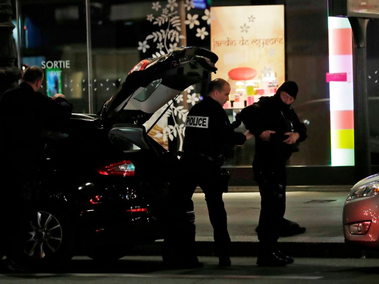 Policemen puts their gear on in Paris centre after one person was killed and several injured by a man armed with a knife, who was shot dead by police in Paris on May 12, 2018. - The attack took place near the city&#39;s main opera house. Police indicated that the attacker had been &#39;overcome&#39; and his motives are unknown. (Photo by Thomas SAMSON / AFP) (Photo credit should read THOMAS SAMSON/AFP/Getty Images)
