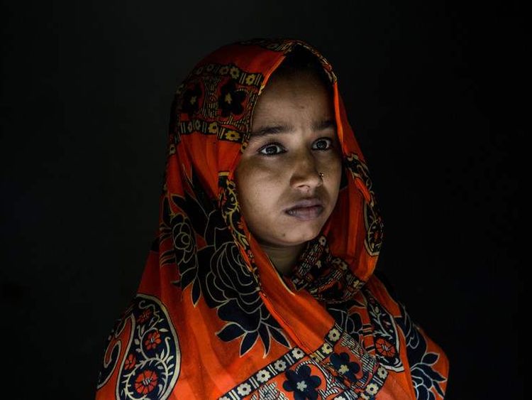 Bina Bala, a 22-year-old who survived a massacre by the armed group ARSA