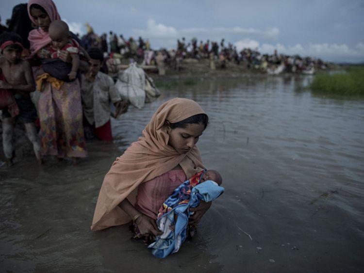 - Rohingya refugees wade while holding a child after crossing the Naf river from Myanmar into Bangladesh in Whaikhyang on October 9, 2017. A top UN official said on October 7 Bangladesh&#39;s plan to build the world&#39;s biggest refugee camp for 800,000-plus Rohingya Muslims was dangerous because overcrowding could heighten the risks of deadly diseases spreading quickly. The arrival of more than half a million Rohingya refugees who have fled an army crackdown in Myanmar&#39;s troubled Rakhine state since A