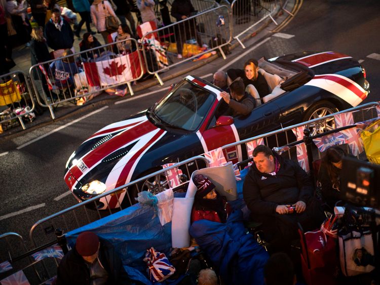 People begin sleeping out to get the best spots to get the best view of the royal couple