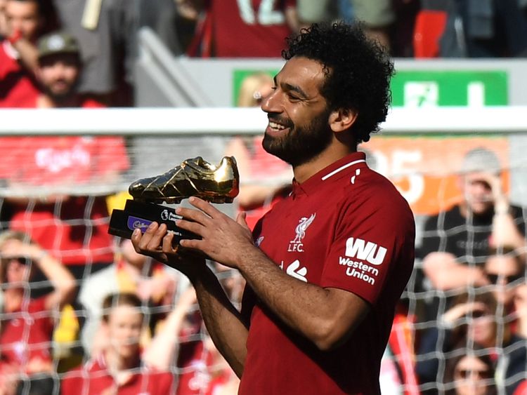 Salah celebrates after being awarded the golden boot award