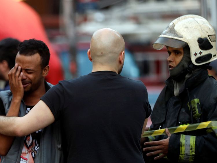 Firefighter comfort a man near the site
