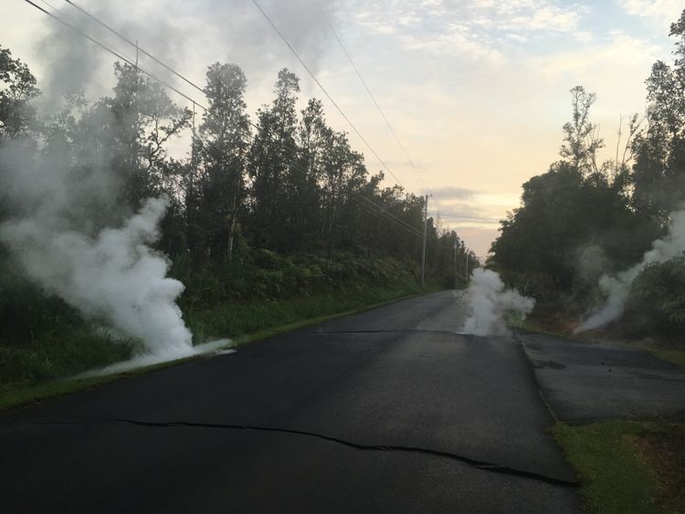 Steam cracks are shown before a fissure opened on Kaupili Street in the Leilani Estates