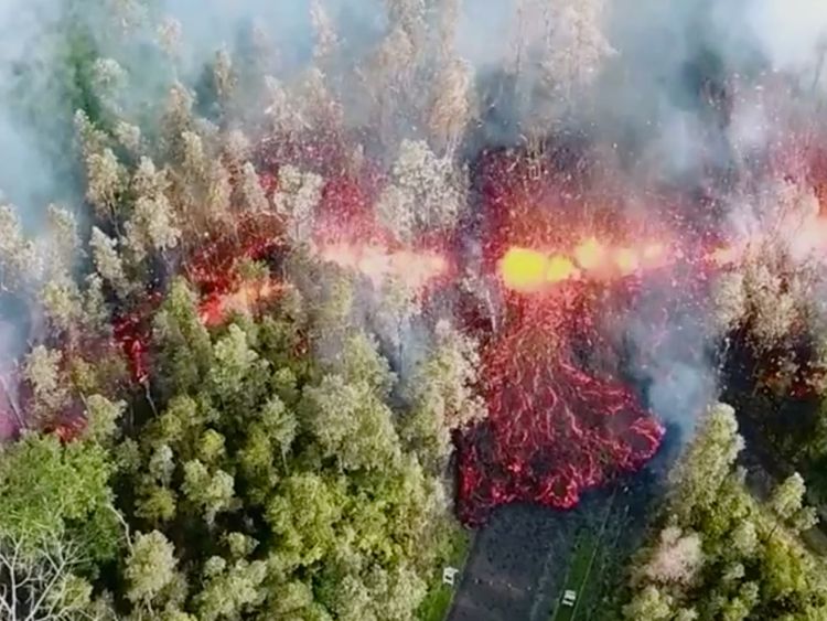 Lava emerges from the ground after Kilauea Volcano erupted, on Hawaii&#39;s Big Island