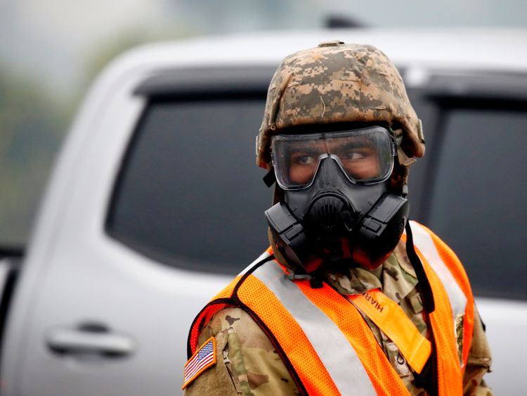 A soldier of the Hawaii Army National Guard wears a mask to protect himself from volcanic gases