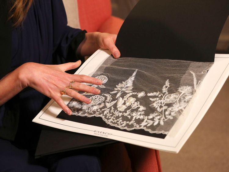 The elaborate veil was embroidered with flowers from each of the 53 Commonwealth nations