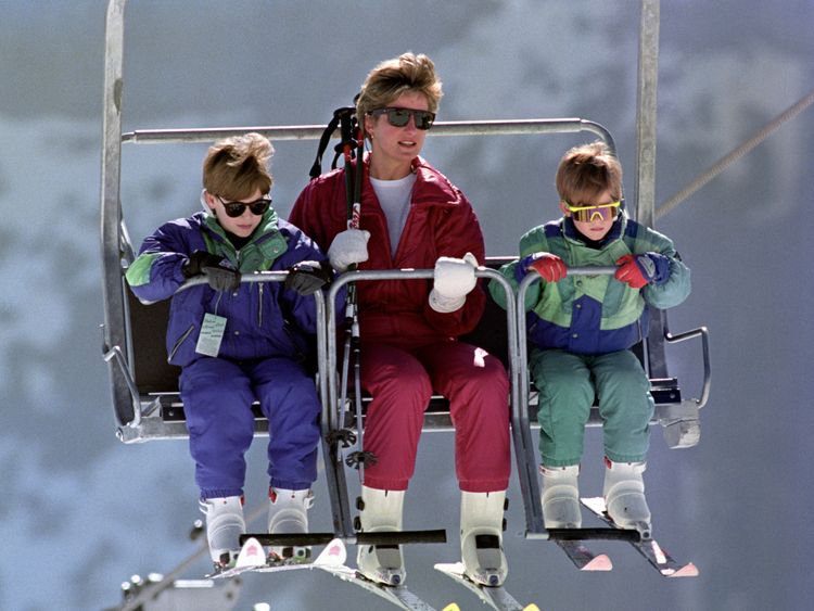 The Princess of Wales rides a chair lift up the Kriegerhorn with her sons Prince William, left, and Prince Harry in 1991