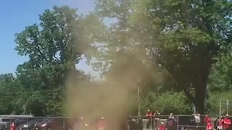 Mini dust devil interrupts Little League baseball game