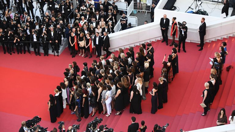Filmmakers, actresses and producers listen to Australian actress and President of the Jury Cate Blanchett read a statement on the red carpet in protest of the lack of female filmmakers honored throughout the history of the festival at the screening of &#39;Girls Of The Sun (Les Filles Du Soleil)&#39; during the 71st annual Cannes Film Festival at the Palais des Festivals on May 12, 2018 in Cannes, southeastern France. - Only 82 films in competition in the official selection have been directed by women s