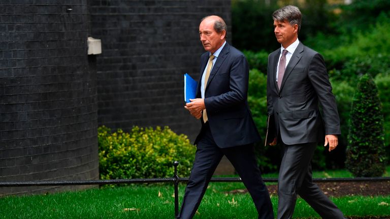 Nestle chairman Paul Bulcke and BMW boss Harald Kruger arrive in Downing St