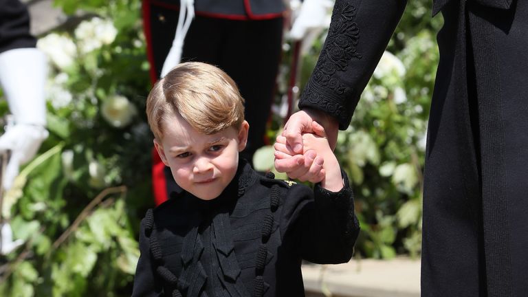 Prince George on the steps of St George&#39;s Chapel in Windsor Castle after the wedding of Prince Harry and Meghan Markle. PRESS ASSOCIATION Photo. Picture date: Saturday May 19, 2018. See PA story ROYAL Wedding. Photo credit should read: Brian Lawless/PA Wire