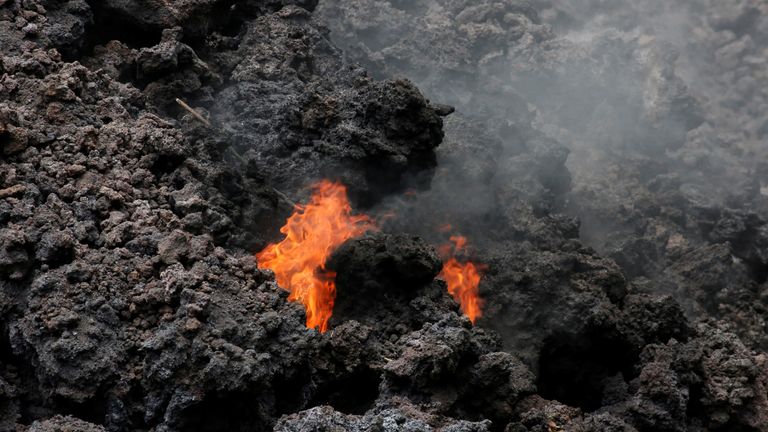 Flames are seen in a lava flow on Highway 137 southeast of Pahoa 