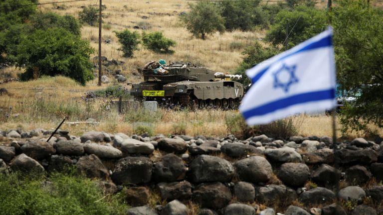 An Israeli tank can be seen near the Israeli side of the border with Syria in the Israeli-occupied Golan Heights, Israel May 9, 2018