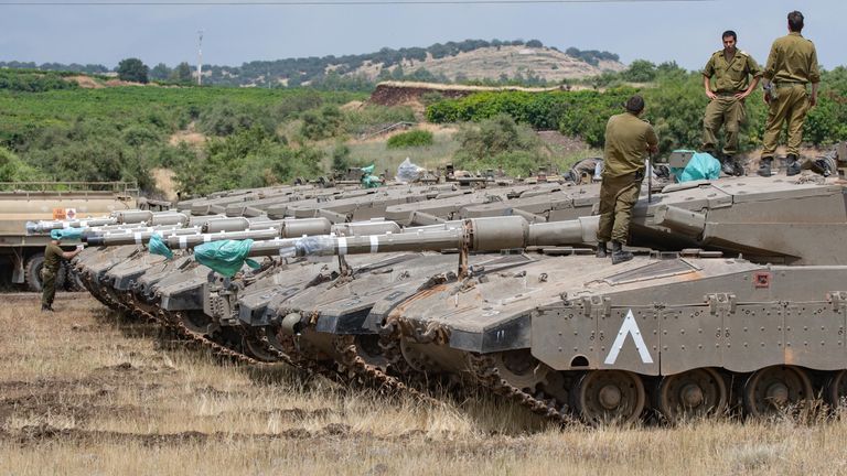 Israeli tanks were seen lined up in the Golan Heights on Thursday