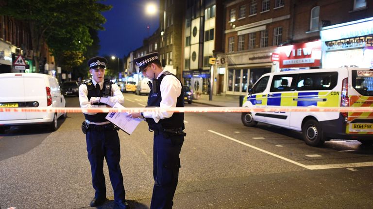 Police officers at the scene in Upper Street following the attack
