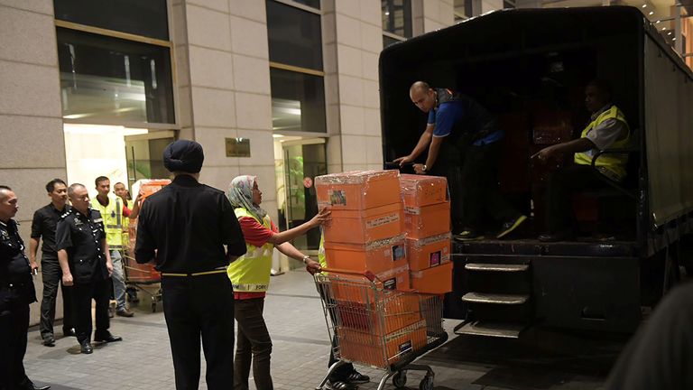 Police took away crates from one of Najib Razak’s apartments in May