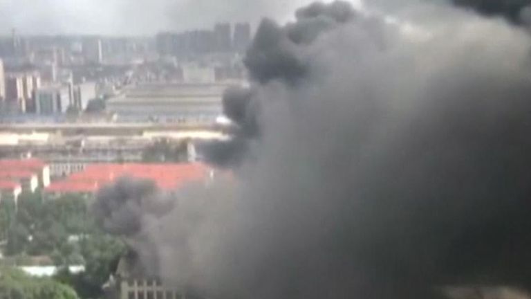 Smoke billows into the sky over Nanning City in China from a warehouse fire