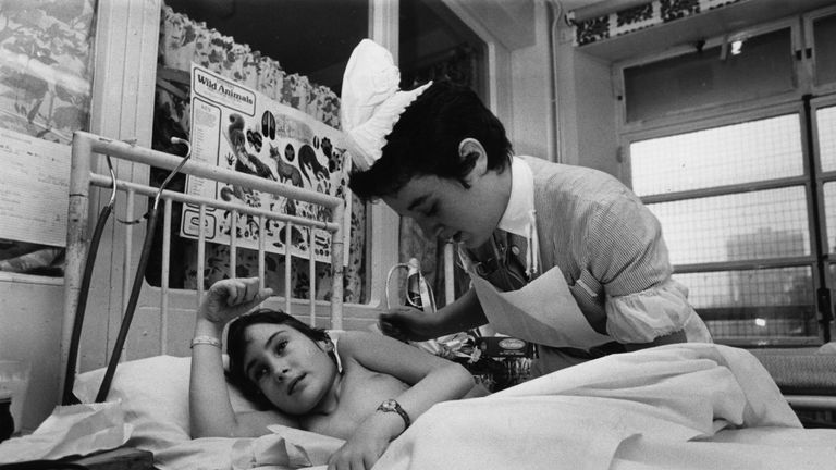 Staff Nurse Rowena Joseph tending a young patient at Great Ormond Street Hospital in 1979