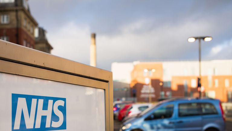 Newcastle, UK - February 10, 2016: The NHS (National Health Service) logo on an entrance sign for the Royal Victoria Infirmary, a teaching hospital which includes an accident and emergency department...Part of an NHS hospital entrance sign in Newcastle, England.