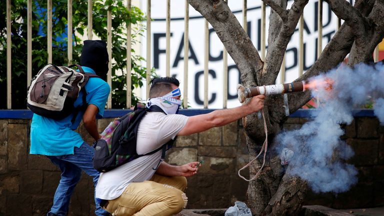 A demonstrator fires a homemade mortar towards riot police during a protest against Nicaragua&#39;s government in Managua, Nicaragua