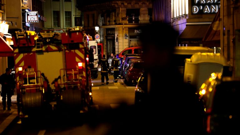 Policemen stand guard in Paris centre past firefighters vehicles after one person was killed and several injured by a man armed with a knife, who was shot dead by police in Paris on May 12, 2018. - The attack took place near the city&#39;s main opera house. Police indicated that the attacker had been &#39;overcome&#39; and his motives are unknown. (Photo by Thomas SAMSON / AFP) (Photo credit should read THOMAS SAMSON/AFP/Getty Images)
