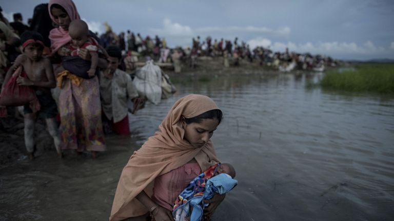 - Rohingya refugees wade while holding a child after crossing the Naf river from Myanmar into Bangladesh in Whaikhyang on October 9, 2017. A top UN official said on October 7 Bangladesh&#39;s plan to build the world&#39;s biggest refugee camp for 800,000-plus Rohingya Muslims was dangerous because overcrowding could heighten the risks of deadly diseases spreading quickly. The arrival of more than half a million Rohingya refugees who have fled an army crackdown in Myanmar&#39;s troubled Rakhine state since A