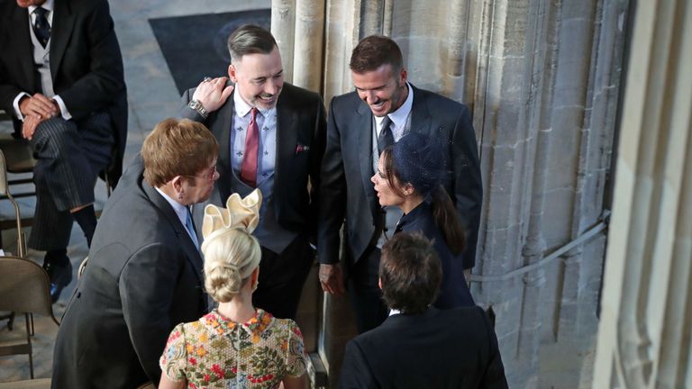 Prince Harry Marries Ms. Meghan Markle - Windsor Castle
WINDSOR, UNITED KINGDOM - MAY 19: David and Victoria Beckham (right) talk with Sir Elton John and David Furnish (left) and Sofia Wellesley and James Blunt (foreground) as they arrive in St George&#39;s Chapel at Windsor Castle for the wedding of Prince Harry to Meghan Markle on May 19, 2018 in Windsor, England.. (Photo by Danny Lawson - WPA Pool/Getty Images)